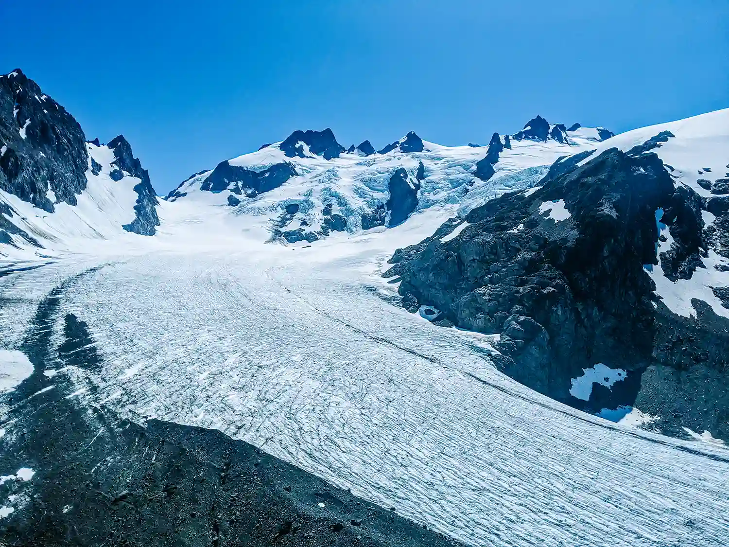 In this guide to backpacking The Hoh Rainforest, you'll oversee a scenic blue glacier moraine at the Olympic National Park in Washington State.