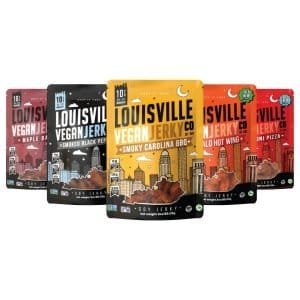 A variety of Louisville Vegan Jerky packets are displayed, offering a plant-based protein option for snacks you can bring on an airplane.