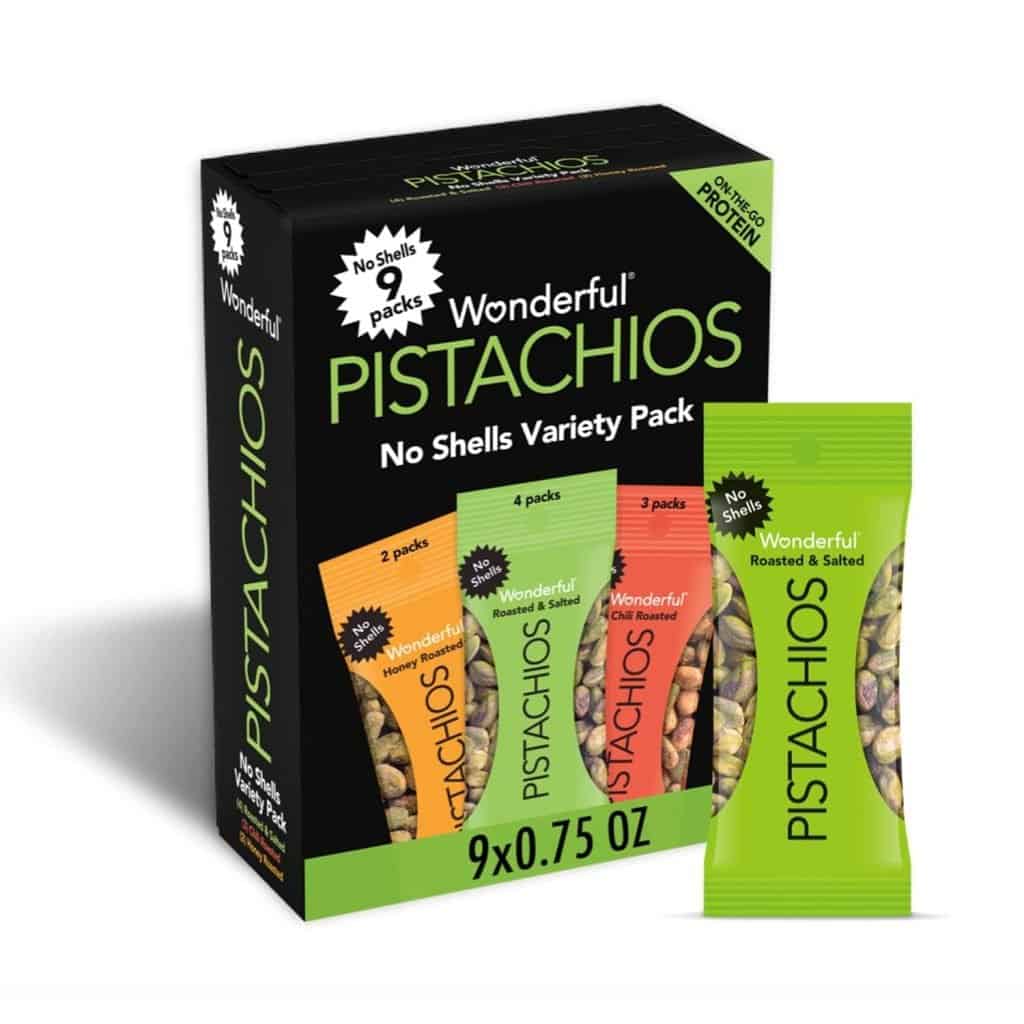 A box of Wonderful Pistachios snack packs, featuring a variety of flavors, makes an ideal choice for snacks you can bring on an airplane, offering a convenient and healthy option.