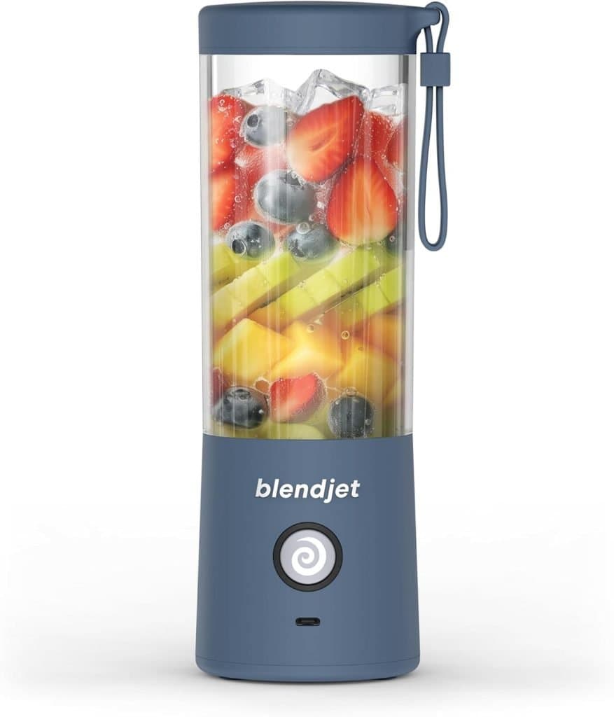 A portable BlendJet blender filled with colorful fruits is a handy way to prepare fresh snacks you can bring on an airplane.