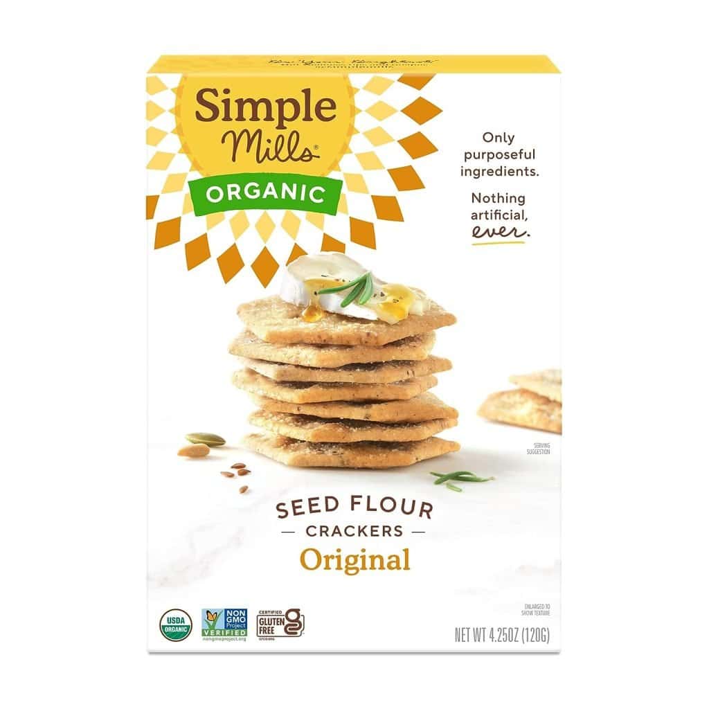 A box of Simple Mills Organic Seed Flour Crackers in the original flavor, which are a light and crispy option for snacks you can bring on an airplane.