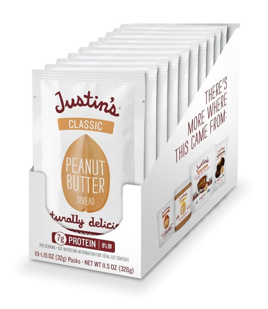 A box of Justin's Classic Peanut Butter squeeze packs, which are convenient snacks you can bring on an airplane for a quick and satisfying treat.