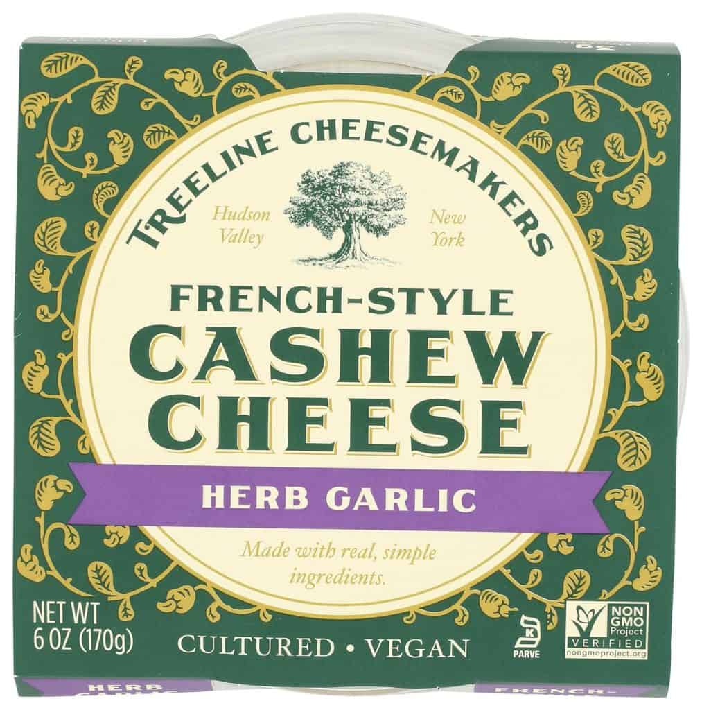 Treeline Herb Garlic Cashew Cheese, a vegan and cultured spread, is a flavorful option among snacks you can bring on an airplane.