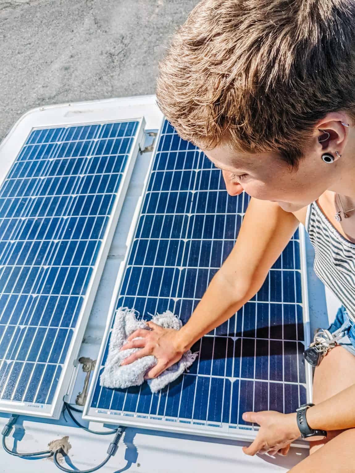 Cleaning the solar panels on my van, which is essential for efficient energy use while living out of a van.