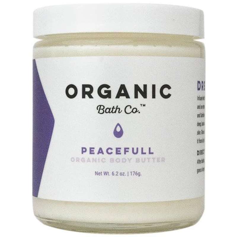 A jar of Organic Bath Co. Peacefull Organic Body Butter, a rich, moisturizing cream made with natural ingredients, making it an ideal choice for zero waste gifts