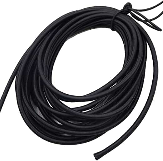 A coiled black rubber tubing, perfect for a camper conversion van project.