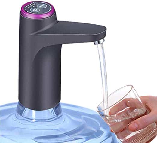 An electric water dispenser attached to a large water jug, with water being poured into a glass is a perfect device for camper conversion van.