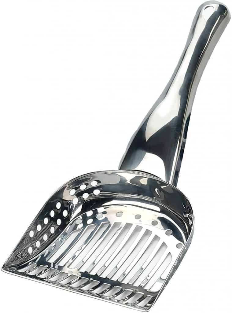 A metal cat litter scoop with a sturdy handle and perforated design, perfect for efficiently cleaning up after your pet in a camper conversion van.