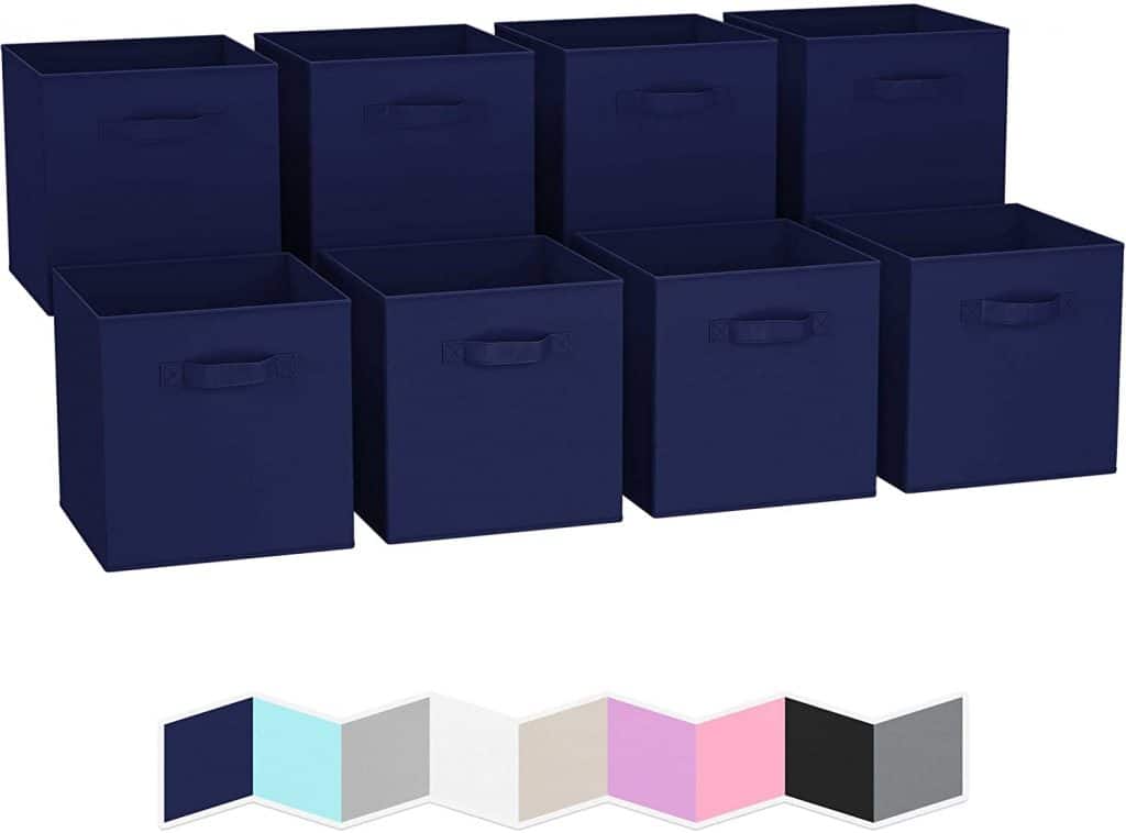 A set of eight navy blue storage cubes, perfect for organizing and maximizing space in a camper conversion van, with additional color options including light blue, white, pink, black, and gray.