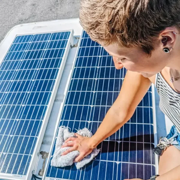 Cleaning the solar panels on my van, which is essential for efficient energy use while living out of a van.