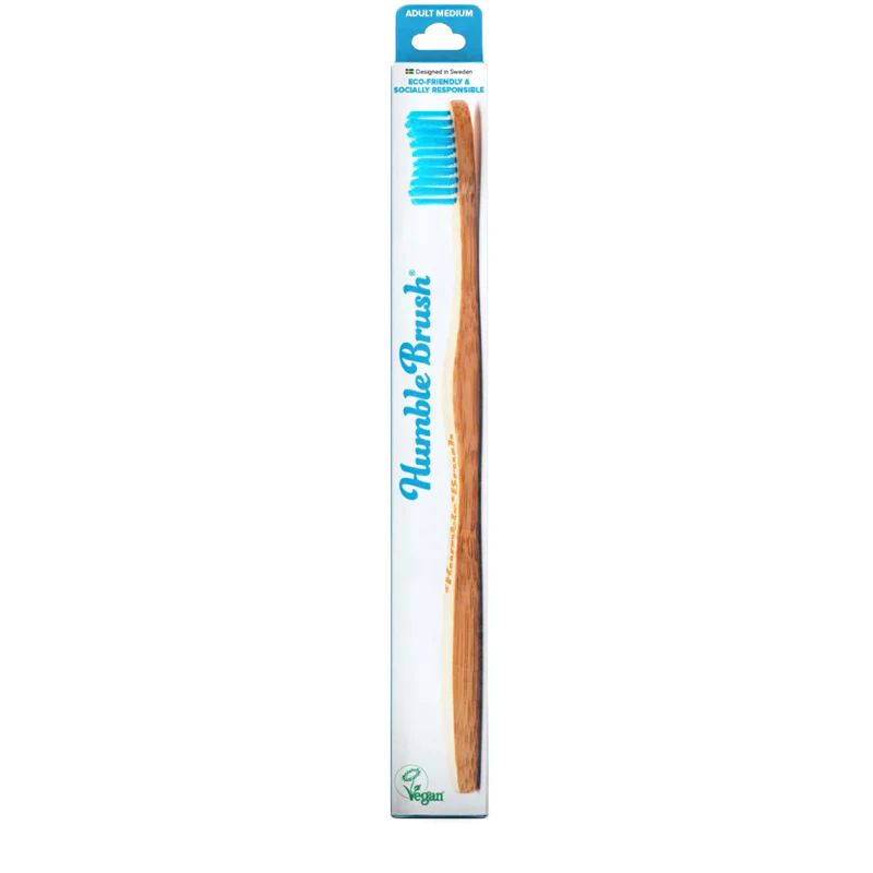 An eco-friendly bamboo toothbrush with blue bristles, perfect for a sustainable gift guide.