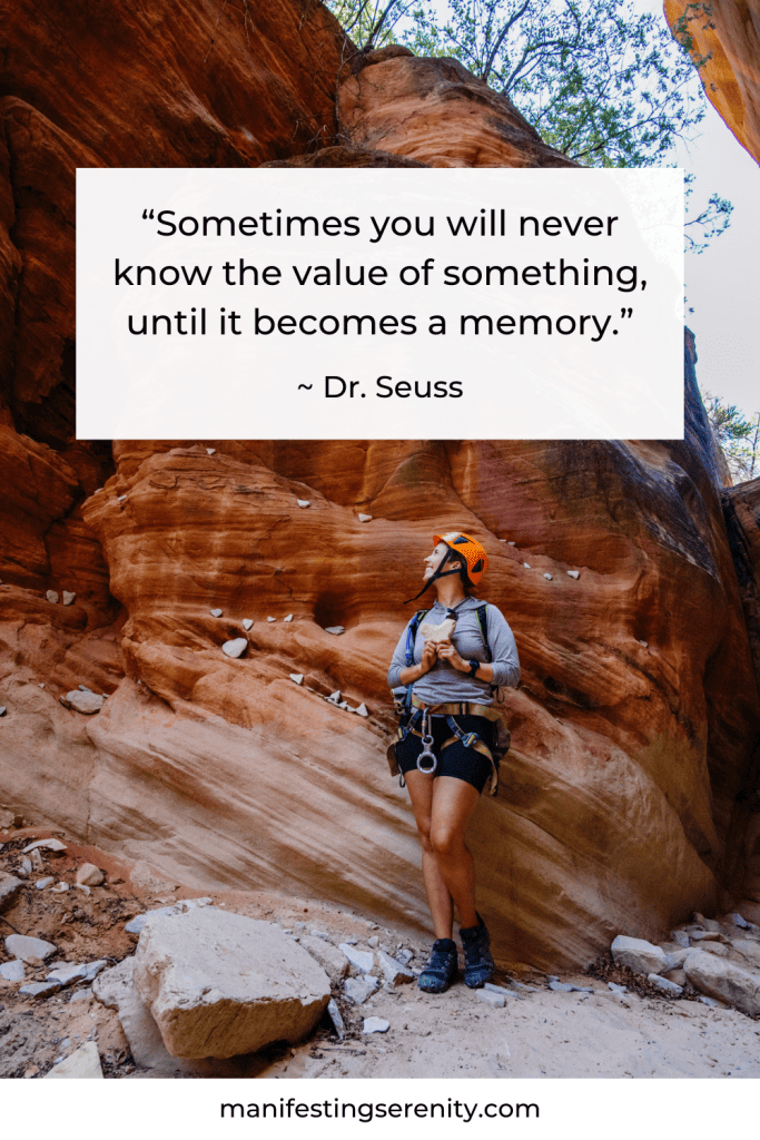 Standing in a rocky canyon, wearing climbing gear and a helmet, looking up at the beautiful red rock formations. The quote above me reads, "Sometimes you will never know the value of something, until it becomes a memory" by Dr. Seuss, making it an ideal example of inspirational adventure quotes.