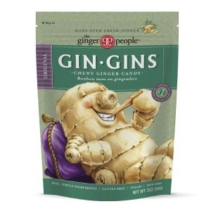 A packet of Gin-Gins chewy ginger candy is shown, a perfect snack you can bring on an airplane to help with motion sickness and enjoy a sweet, spicy treat.