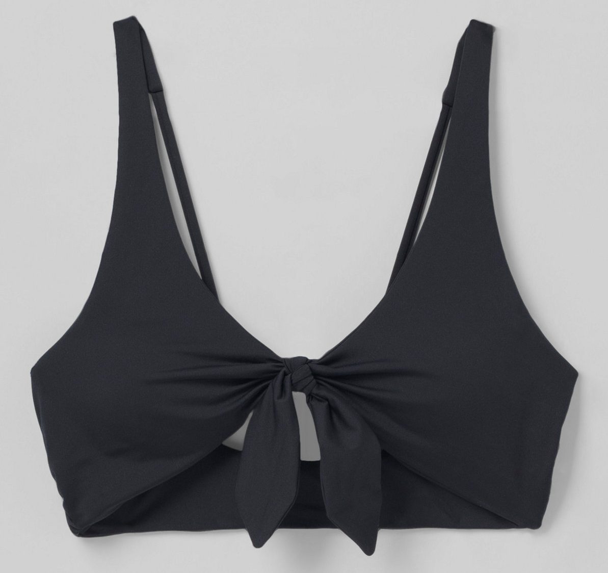 A black bikini top with a front tie, perfect for wearing while enjoying a swim at Cibecue Falls.