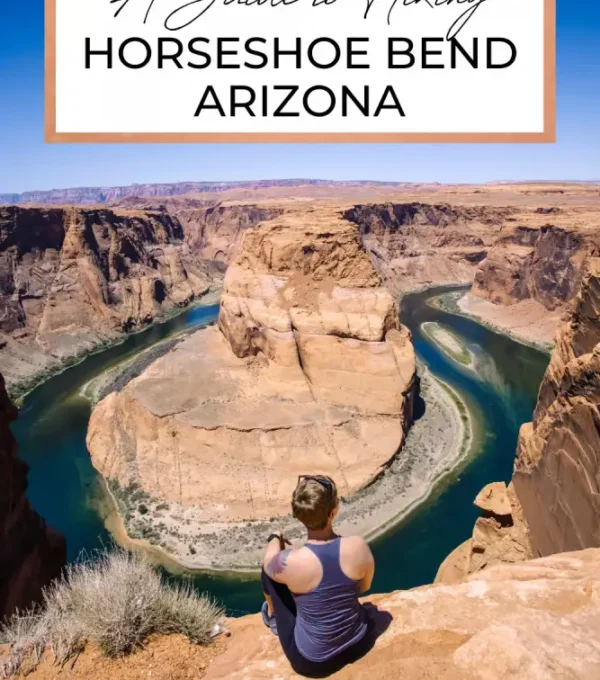 The iconic Horseshoe Bend in Arizona, where the Colorado River curves around a striking red rock formation. The dramatic shape of the river and the surrounding cliffs create a stunning, almost surreal landscape.