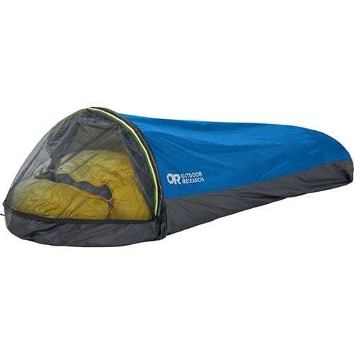 A blue and gray bivy sack from Outdoor Research, designed to be a lightweight and compact shelter, perfect for the ultimate backpacking packing list.