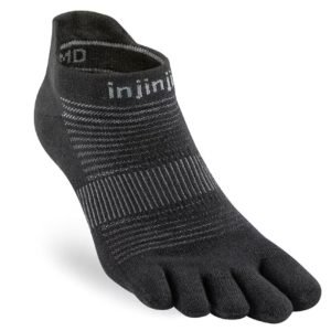 A black toe sock, perfect for wearing during a Vipassana Meditation Retreat to ensure comfort and flexibility during long hours of sitting and walking.