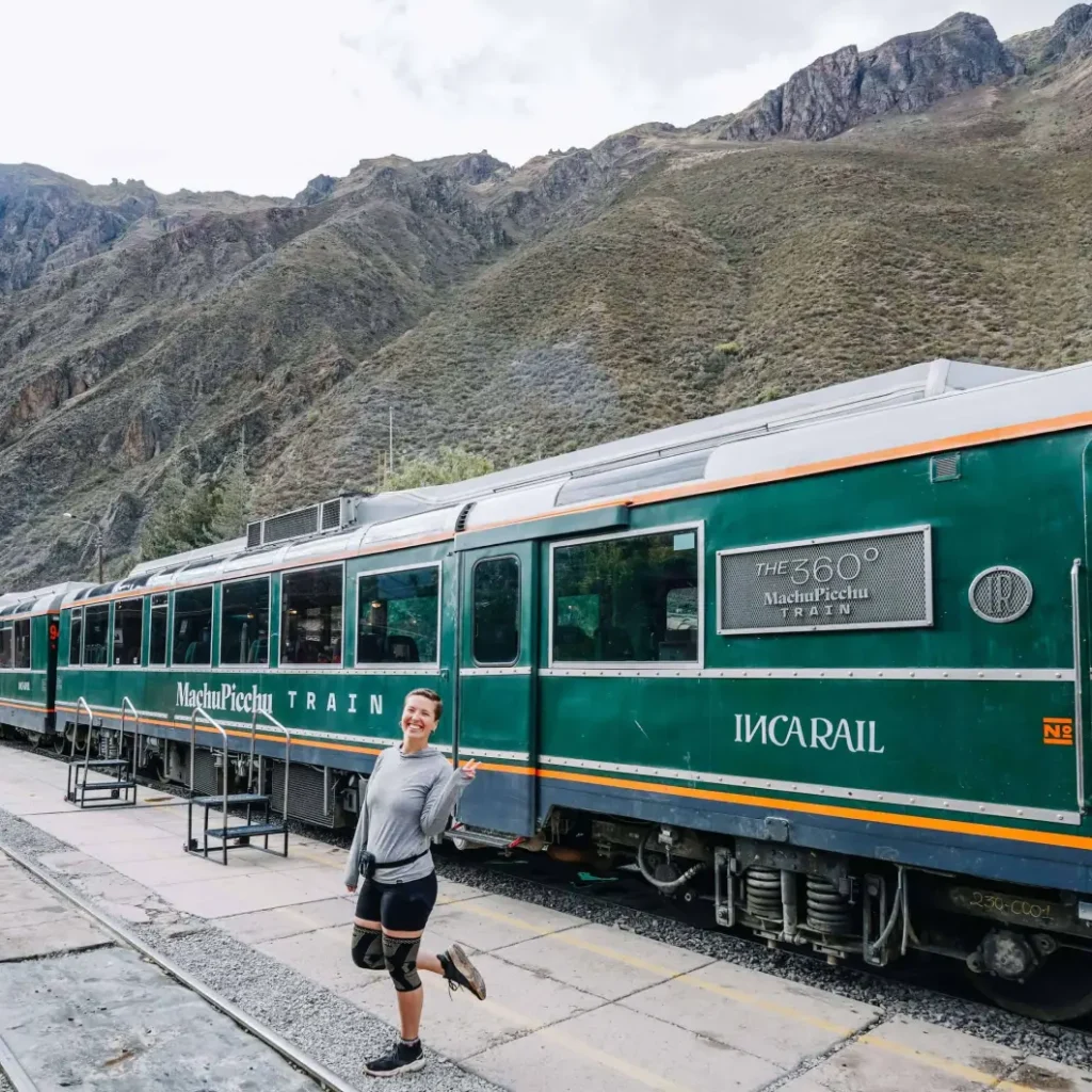 Here I am standing in front of the Machu Picchu train with the mountains in the background. Riding the Machu Picchu train is one of the top things to do at Machu Picchu.