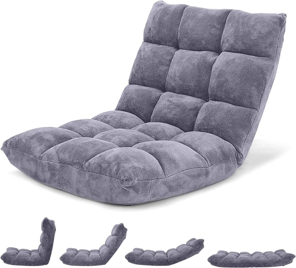 A gray, adjustable floor chair with a plush, quilted design, perfect for providing comfort during long meditation sessions at a Vipassana Meditation Retreat.