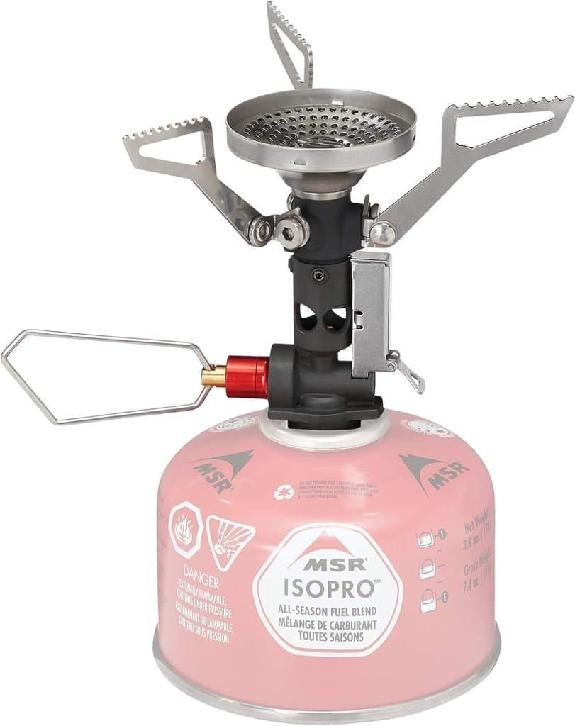 An MSR Isopro backpacking stove, a compact and efficient cooking device essential for meal preparation on the ultimate backpacking packing list.