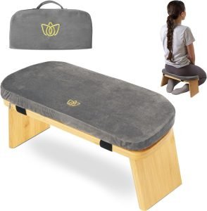 At a Vipassana Meditation Retreat, participants may use a meditation bench like the one pictured, which features a padded seat and wooden legs.