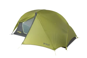 A green backpacking tent with a rainfly, designed to be lightweight and compact, perfect for the ultimate backpacking packing list.